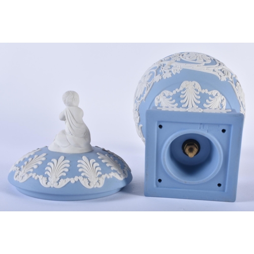 84 - A LOVELY WEDGWOOD BLUE JASPER WARE VASE AND COVER formed with a putti finial, upon a body decorated ... 