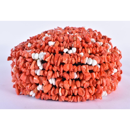 841 - AN UNUSUAL TWO COLOUR CORAL HAT. 20 cm x 17 cm.