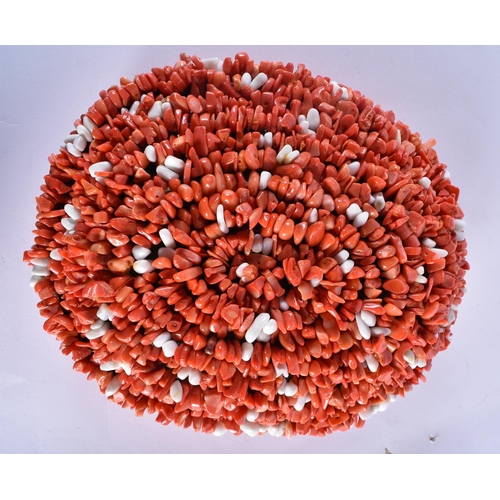 841 - AN UNUSUAL TWO COLOUR CORAL HAT. 20 cm x 17 cm.