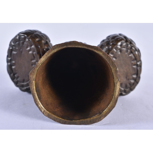 846 - AN ANTIQUE FRENCH BRONZE CANDLE SNUFFER formed as a female with baskets. 10 cm x 8 cm.