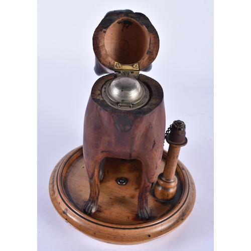 847 - A 19TH CENTURY BAVARIAN BLACK FOREST CARVED WOOD INKWELL formed as a seated hound. 22 cm x 14 cm.