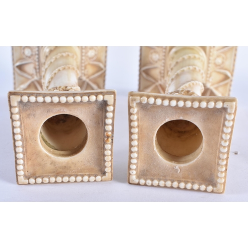 853 - A PAIR OF ROYAL WORCESTER BLUSH IVORY CANDLESTICKS. 27 cm high.