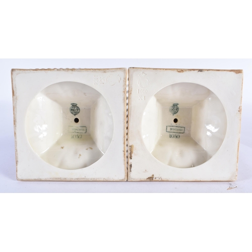 853 - A PAIR OF ROYAL WORCESTER BLUSH IVORY CANDLESTICKS. 27 cm high.