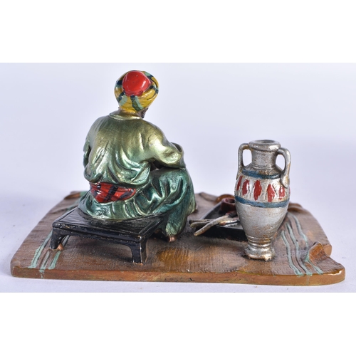 854 - AN AUSTRIAN COLD PAINTED BRONZE FIGURE OF A TURKISH TRADESMAN. 10 cm x 8 cm.