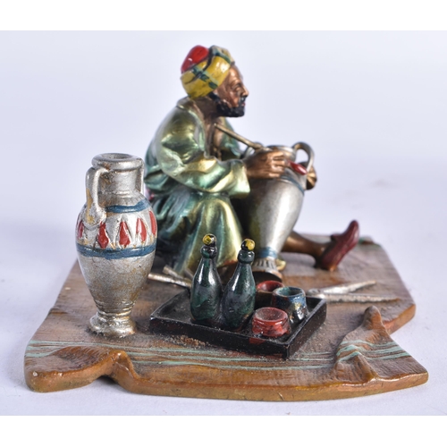 854 - AN AUSTRIAN COLD PAINTED BRONZE FIGURE OF A TURKISH TRADESMAN. 10 cm x 8 cm.