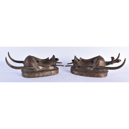 866 - A PAIR OF AFRICAN BRONZE TRIBAL MASKS. 35 cm x 10 cm.