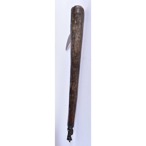 876 - A TRIBAL CARVED WOOD AXE. 55 cm long.