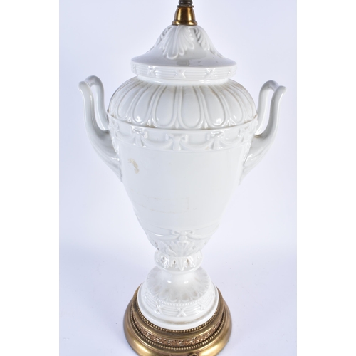 878 - A LARGE CONTINENTAL TWIN HANDLED WHITE PORCELAIN VASE LAMP. 68 cm high.