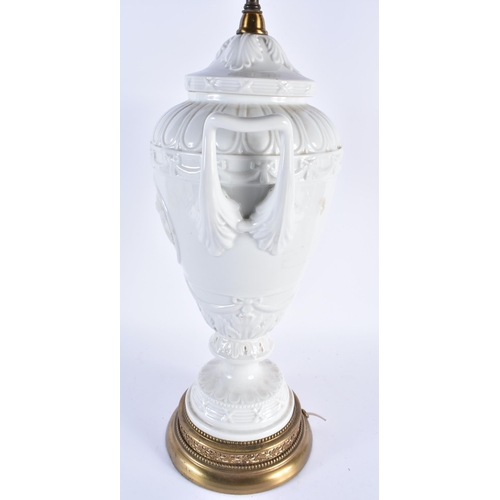 878 - A LARGE CONTINENTAL TWIN HANDLED WHITE PORCELAIN VASE LAMP. 68 cm high.