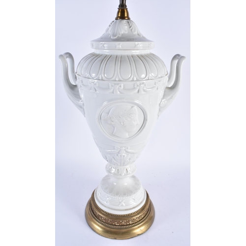 878 - A LARGE CONTINENTAL TWIN HANDLED WHITE PORCELAIN VASE LAMP. 68 cm high.