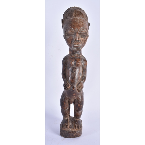 883 - THREE TRIBAL CARVED AFRICAN FIGURES. Largest 34 cm high. (3)