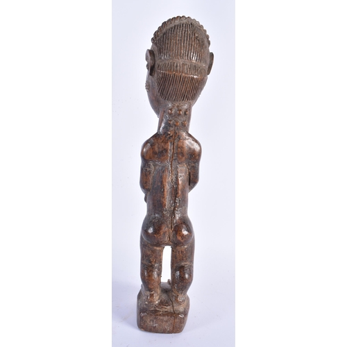 883 - THREE TRIBAL CARVED AFRICAN FIGURES. Largest 34 cm high. (3)