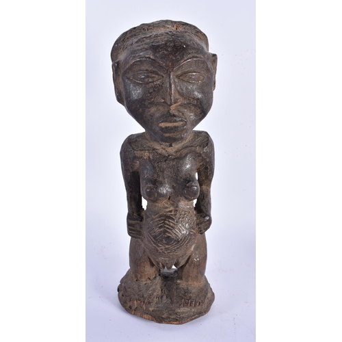 883 - THREE TRIBAL CARVED AFRICAN FIGURES. Largest 34 cm high. (3)