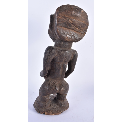 883 - THREE TRIBAL CARVED AFRICAN FIGURES. Largest 34 cm high. (3)