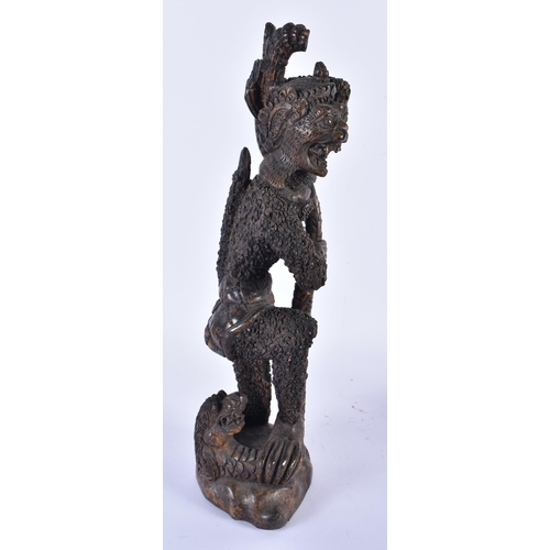 883 - THREE TRIBAL CARVED AFRICAN FIGURES. Largest 34 cm high. (3)