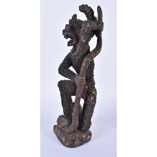 883 - THREE TRIBAL CARVED AFRICAN FIGURES. Largest 34 cm high. (3)