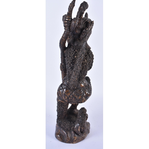 883 - THREE TRIBAL CARVED AFRICAN FIGURES. Largest 34 cm high. (3)