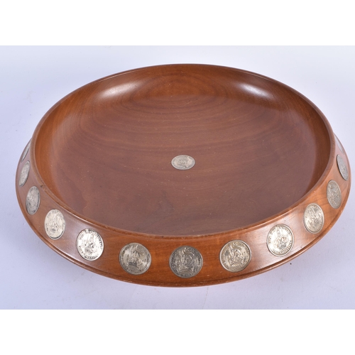 894 - A SCOTTISH DUNDEE SILVER AND TURNED WOOD COIN BOWL. 30cm diameter.