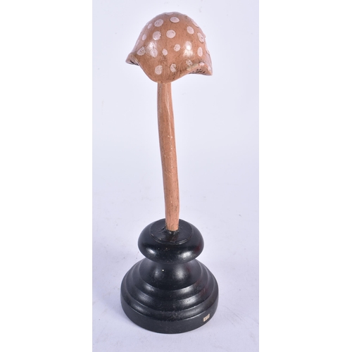 911 - AN UNUSUAL CARVED FOLK ART PAINTED WOOD MUSHROOM SPECIMEN. 23cm high.