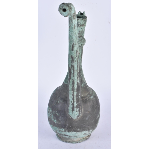 933 - An Early Middle Eastern Copper Ewer.  35cm x 17cm