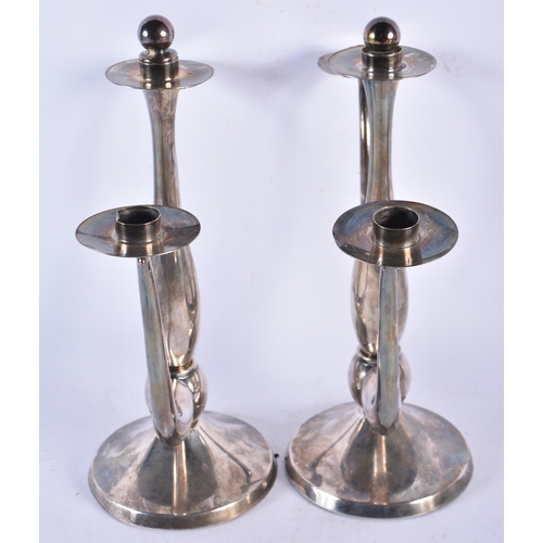 936 - A Pair of Eugen Ferner Silver Plated Candlesticks.  30cm x 30cm x 12cm (2)