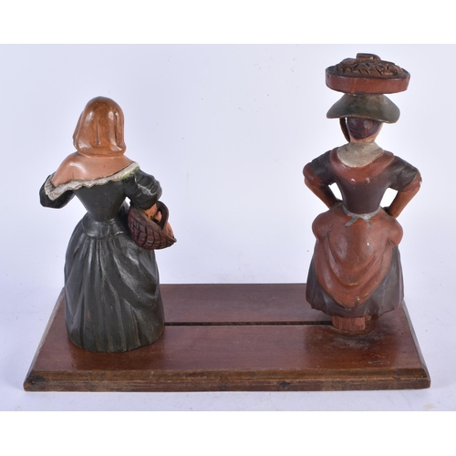 938 - A Naive Folf Art Book Slide the ends carved as two 17th Century Peasant Ladies.  30cm x 23cm x 14cm