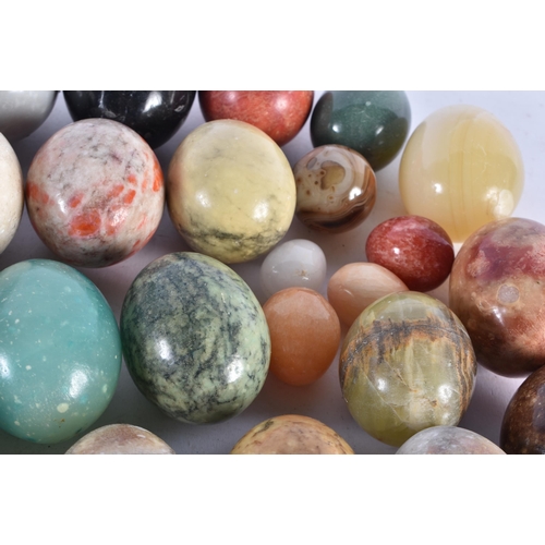 944 - A Collection of Hardstone Eggs in an associated Box.  Largest 14.5cm x 9cm (27)