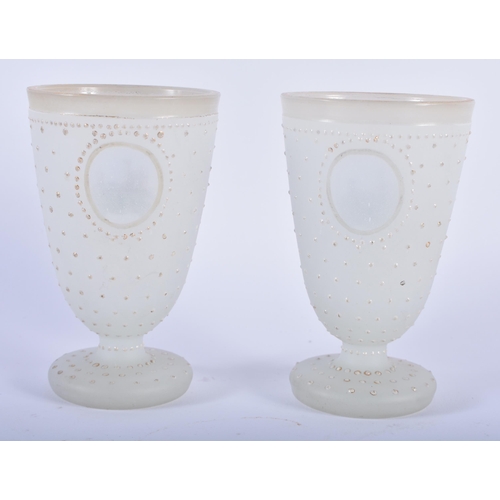 95 - A PAIR OF ANTIQUE OPALINE JEWELLED GLASS BEAKERS painted with German landmarks. 11cm x 6 cm.