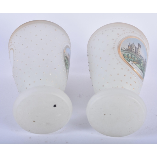 95 - A PAIR OF ANTIQUE OPALINE JEWELLED GLASS BEAKERS painted with German landmarks. 11cm x 6 cm.