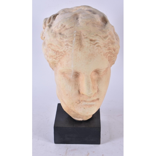 955 - A Classical Female Terracotta Head on a Plinth.  Stamped Made in Greece.  27cm x 14cm x 19cm