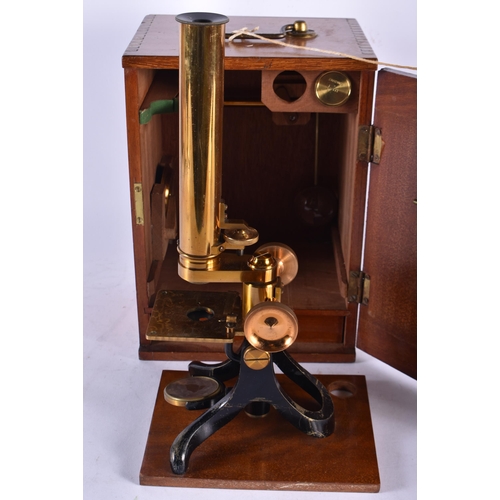 971 - A Vintage Brass Microscope in a Fitted Wooden Box with key.   Box 26.5cm x 19cm x 14.5cm