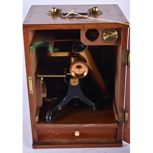 971 - A Vintage Brass Microscope in a Fitted Wooden Box with key.   Box 26.5cm x 19cm x 14.5cm