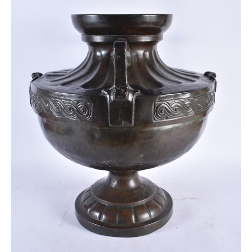 986 - An Arts and Crafts Celtic Style Bronze 2 Handled Urn.  46cm x 41cm