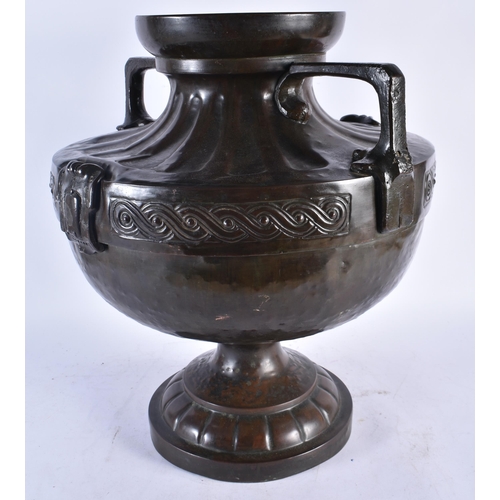 986 - An Arts and Crafts Celtic Style Bronze 2 Handled Urn.  46cm x 41cm