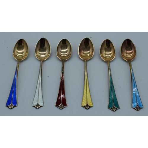 1006 - A CASED SET OF DANISH DAVID ANDERSEN SILVER AND ENAMEL SPOONS. 61 grams. 10 cm x 2 cm. (6)