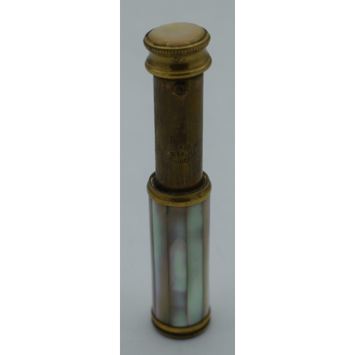 1007 - AN ANTIQUE MOTHER OF PEARL SPRINGING SCENT BOTTLE. 48 grams. 10 cm x 2 cm extended.