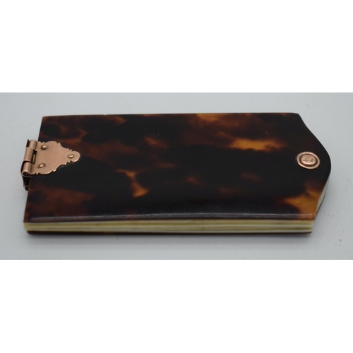 1020 - AN EARLY VICTORIAN TORTOISESHELL DAYS OF THE WEEK POCKET BOOK. 29 grams. 7.5 cm x 3.5 cm.