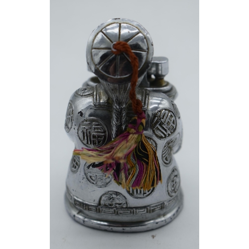 1030 - A NOVELTY CHROME SEATED CHINAMAN DRAGON LIGHTER. 209 grams. 9 cm x 5.5 cm.