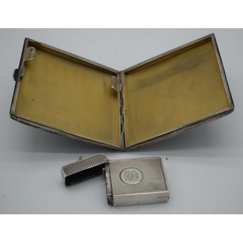 1032 - AN ANTIQUE SILVER VESTA CASE together with a silver cigarette case. Birmingham 1882 & 1932. 170 gram... 