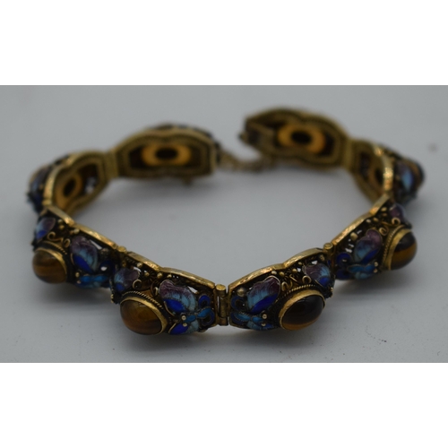 1033 - A LATE 19TH CENTURY CHINESE SILVER GILT ENAMEL AND TIGERS EYE BRACELET. 29 grams. 18cm long.