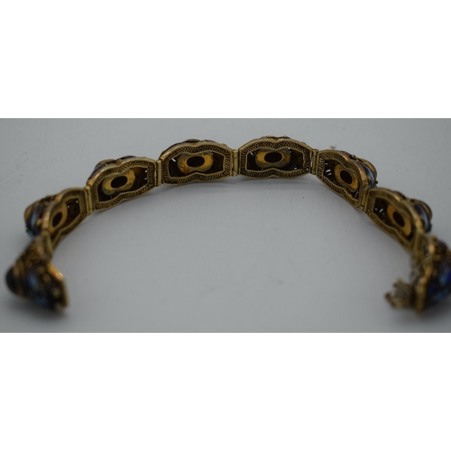 1033 - A LATE 19TH CENTURY CHINESE SILVER GILT ENAMEL AND TIGERS EYE BRACELET. 29 grams. 18cm long.