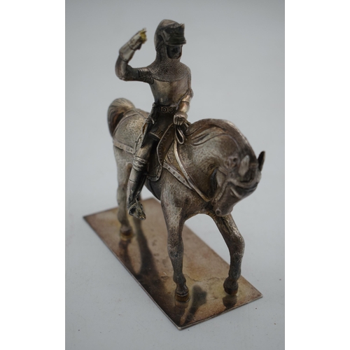 1041 - A FINE 19TH CENTURY ENGLISH WHITE METAL FIGURE OF A SOLDIER ON HORSEBACK. 707 grams. 12.5 cm x 11cm.