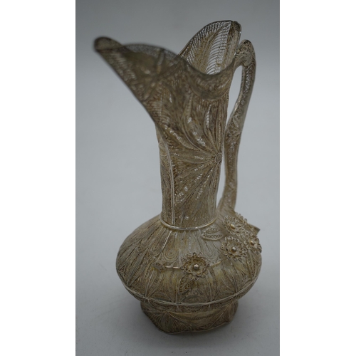 1043 - AN UNUSUAL CONTINENTAL SILVER FILIGREE BIRD AND FLOWER JUG. 171 grams. 17 cm x 14 cm.