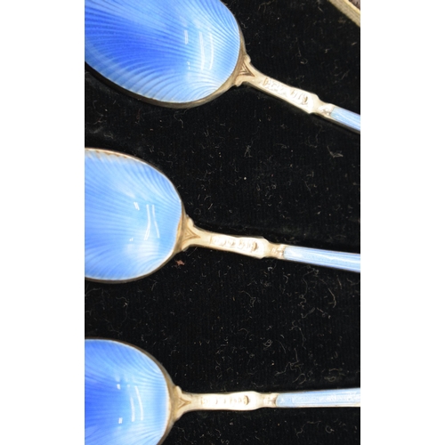 1056 - A SET OF SIX ART DECO SILVER AND ENAMEL COFFEE SPOONS. 81 grams. 10.5 cm long. (6)