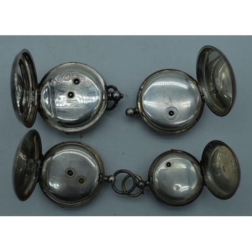 1084 - FOUR ANTIQUE SILVER POCKET WATCHES. 382 grams. Largest 5.5 cm diameter. (4)