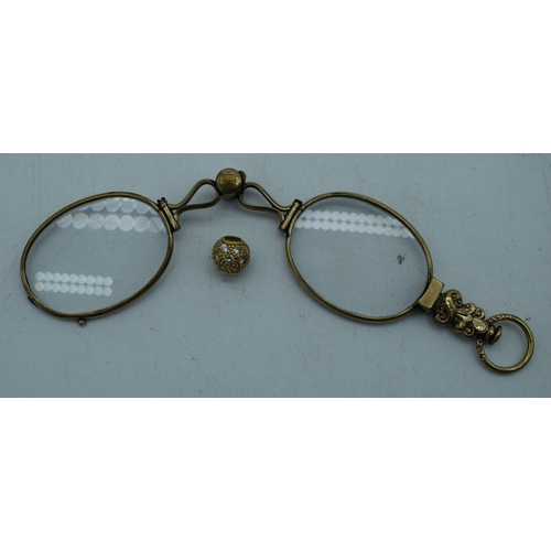 1085 - A PAIR OF ANTIQUE YELLOW METAL LORGNETTES. 16 grams. 12.5 cm x 2.75 cm extended. (2)