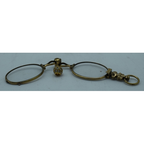 1085 - A PAIR OF ANTIQUE YELLOW METAL LORGNETTES. 16 grams. 12.5 cm x 2.75 cm extended. (2)