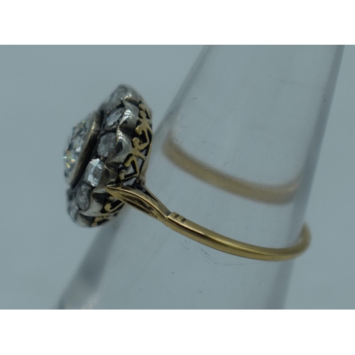 1102 - A LARGE ANTIQUE GOLD AND DIAMOND COCKTAIL CLUSTER RING. L. 2.3 grams. Central stone 0.5 cm x 0.5 cm.