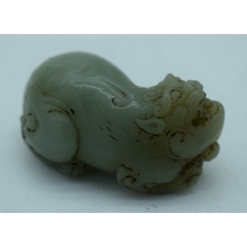 1139 - A CHINESE JADE FOO DOG. 51 grams. 5 cm x 3 cm.