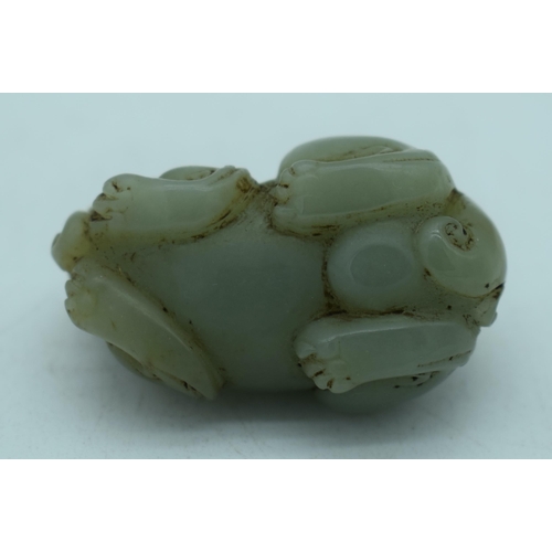 1139 - A CHINESE JADE FOO DOG. 51 grams. 5 cm x 3 cm.